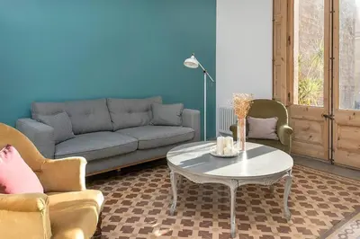 a living room with a couch and a table at Canela Homes BARCELONA CONCEPCIÓ in Barcelona