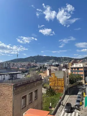 a view of a city from a building at Urban Flats Park Guell in Barcelona