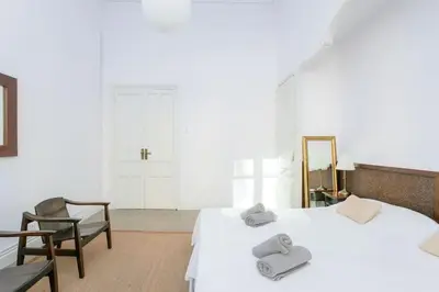 a bedroom with two beds with towels on them at Canela Homes BARCELONA CASA SERRA in Barcelona