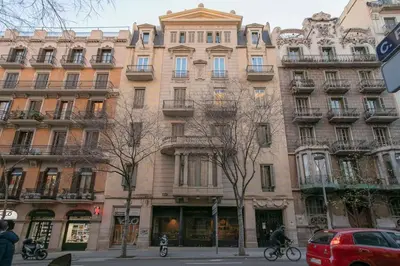 a large building on the corner of a street at Canela Homes BARCELONA CASA SERRA in Barcelona
