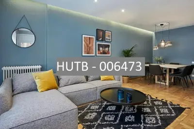 a living room with a couch and a table at Canela Homes BARCELONA TETUAN in Barcelona