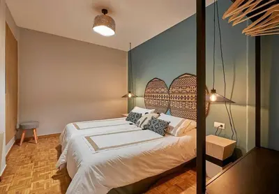 a bedroom with a large bed in a room at Canela Homes BARCELONA TETUAN in Barcelona