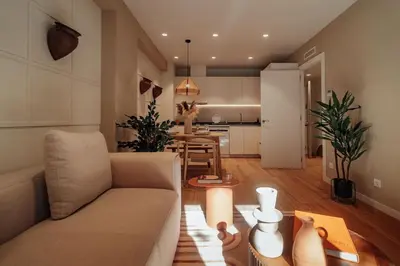 a living room with a couch and a table at Casa Marina in Barcelona