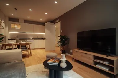 a living room with a large flat screen tv at Casa Tila in Barcelona