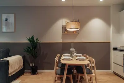 a dining room with a table and chairs at Casa Tila in Barcelona