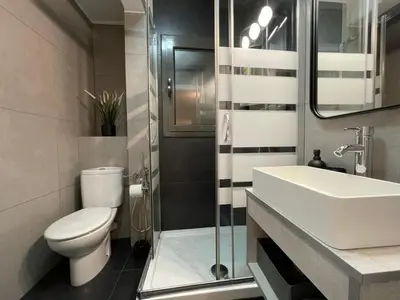 a bathroom with a white toilet and a sink at 15 min en metro a Sagrada Familia in Sant Adria de Besos