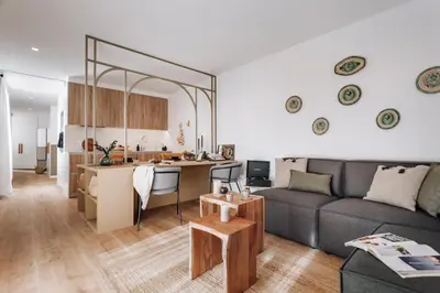 a dining room with a table and chairs at Olivo - 1 bedroom and terrace in Eixample Esquerra in Barcelona