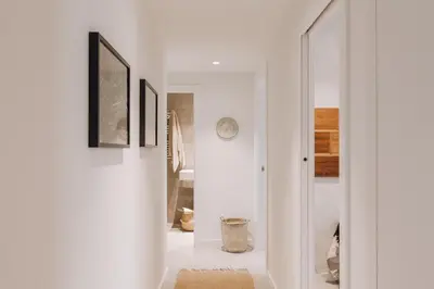 a living room with a couch and a table at Ferrat - 3 bedrooms in Eixample Esquerra in Barcelona