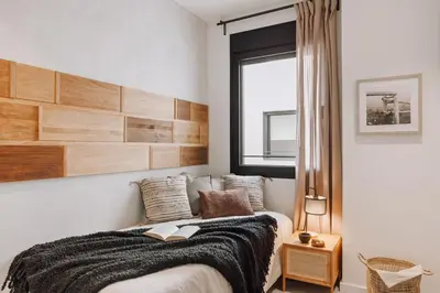 a dining room and living room with a table and chairs at Ferrat - 3 bedrooms in Eixample Esquerra in Barcelona