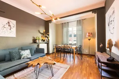 a living room with a couch and a table at Canela Homes BARCELONA INDÚSTRIA in Barcelona