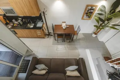 a living room with a couch and a table at Chic Poble Nou Loft Terrace & Close to The Beach in Barcelona