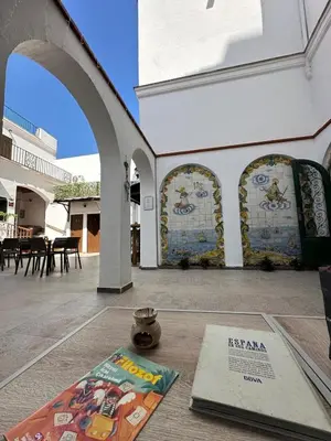 a building with a table with a book on it at Vilador Barcelona Beach Hotel in Masnou