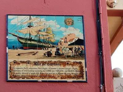 a painting of a ship on the side of a building at Hotel Llar de Capitans in Masnou