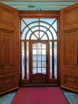 an empty room with a door and a window at Hotel Llar de Capitans in Masnou