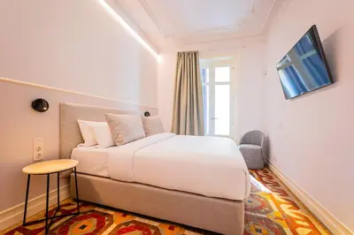 a bedroom with a bed and a window at Sweett - La Gran Via in Barcelona