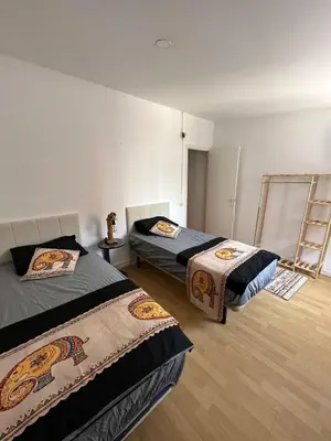 a room with two beds and a ladder in it at Vista Alegre Casa Rest House in Vallromanas