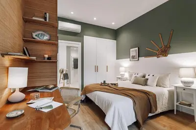 a dining room table with chairs with a candle and fruit at Niebla - 1 bedroom in Eixample Esquerra in Barcelona