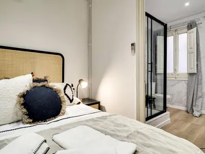 a bedroom with a bed with a pillow on it at Casa modernista en Paseo de Gracia in Barcelona