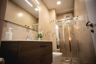 a bathroom with a shower with a toilet and a sink at Habitación Montgros en Casa Camí de les Aigües Monistrol de Montserrat in Monistrol