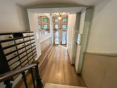 an empty hallway with a room with a window and a door at Stay U-nique Apartments Rossello in Barcelona