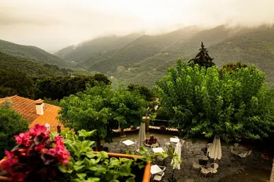 a view of a valley with mountains in the background at Hostal Montserrat in Montseny