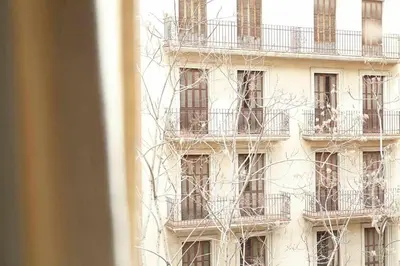a building with balconies on the side of it at SAGRADA FAMILIA SUN Nos preocupa su seguridad in Barcelona
