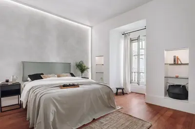 a dining room and living room with a table and chairs at Zuheros - 2 bedrooms in Eixample Dreta in Barcelona