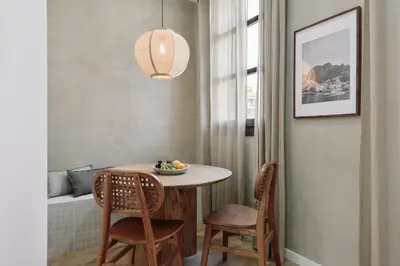a living room with a couch and a kitchen at Vietri - 2 bedrooms and terrace in Sant Antoni in Barcelona