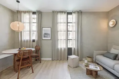 a bedroom with a bed with a tray of food on it at Vietri - 2 bedrooms and terrace in Sant Antoni in Barcelona