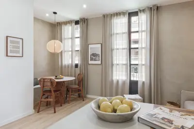 a living room with a bowl of fruit on a table at Vietri - 2 bedrooms and terrace in Sant Antoni in Barcelona