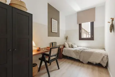 a small dining room with a table and two chairs at Vietri - 2 bedrooms and terrace in Sant Antoni in Barcelona