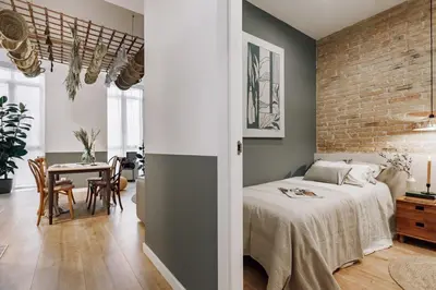 a hallway with gray and white walls and a wooden floor at Aroche - 2 bedrooms in Sant Antoni in Barcelona