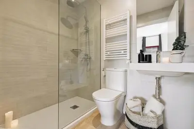 a bedroom with a bed and a desk and a window at Canyelles - 2 bedrooms in Sant Antoni in Barcelona