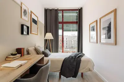 a kitchen with a table and a dining room at Canyelles - 2 bedrooms in Sant Antoni in Barcelona
