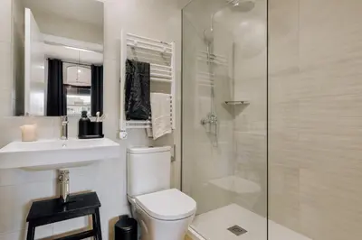 a bedroom with a bed and a desk and a table at Vent - 2 bedrooms in Sant Antoni in Barcelona