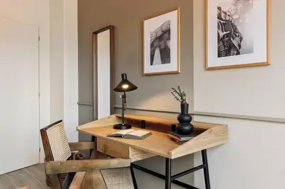 a kitchen with a table and chairs in a kitchen at Vent - 2 bedrooms in Sant Antoni in Barcelona