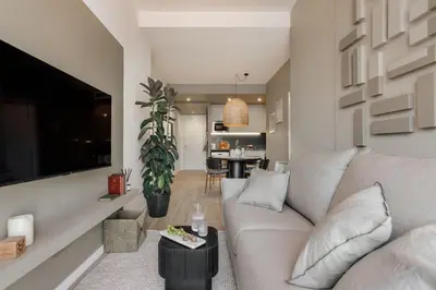 a bedroom with a bed and a large window at Vent - 2 bedrooms in Sant Antoni in Barcelona