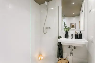 a dining room with a table and chairs at Loja - 2 bedrooms in Sant Antoni in Barcelona