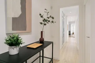 a kitchen with a black counter with a plant on it at Cathedral Ramblas Apartment in Barcelona