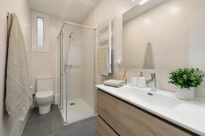 a bathroom with a sink and a toilet and a shower at Cathedral Ramblas Apartment in Barcelona