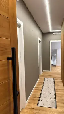 a hallway with a door and a door mat on the floor at esplugues de llobregat in Barcelona