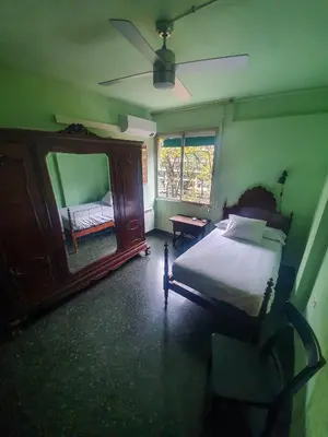 a bedroom with a bed and a dresser and a mirror at Josep Tarradellas 80 in Barcelona