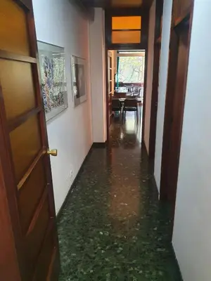 a hallway with a floor that is covered in water at Josep Tarradellas 80 in Barcelona