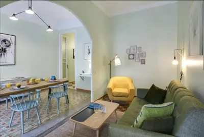 a living room with a couch and a table at Passeig Sant Joan in Barcelona