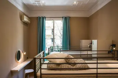 a bedroom with two bunk beds and a window at Born Barcelona Hostel in Barcelona