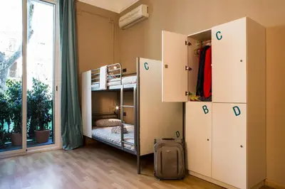 a room with bunk beds and a window at Born Barcelona Hostel in Barcelona