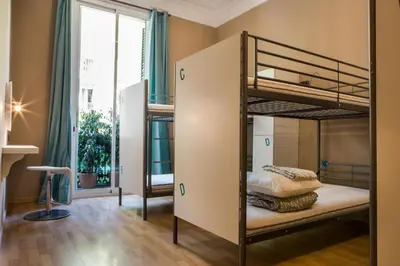a bedroom with bunk beds and a window at Born Barcelona Hostel in Barcelona