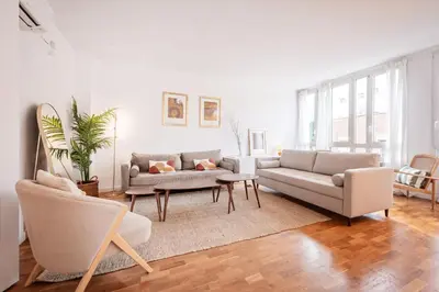 a living room with two couches and a table at Sweett - Nova Icaria Beach in Barcelona
