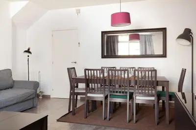 a dining room with a table and chairs at Canela Homes BARCELONA AUSIAS MARC in Barcelona