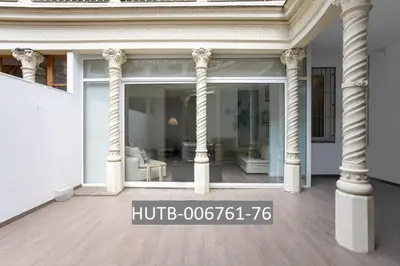 a large white house with columns on a porch at Canela Homes BARCELONA VALÈNCIA in Barcelona